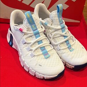 Nike White Athletic Shoes with Blue and Pink Highlights